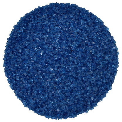 Close-up of dark blue sanding sugar showing a circular mound of coarse, translucent deep blue sugar crystals with sparkling, faceted surfaces against a white background.