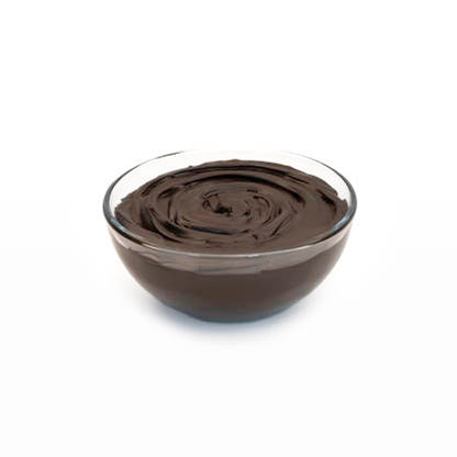 Glass bowl filled with dark chocolate ganache on a white background