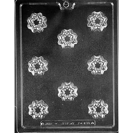 Clear plastic chocolate mold with nine cavities in a flower shape, used for making candy or chocolate.