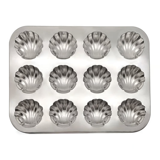 Metal muffin tin with shell-shaped molds on a white background