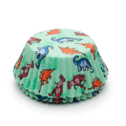 Stack of dinosaur-themed cupcake liners featuring colorful prehistoric creatures on a light green background.