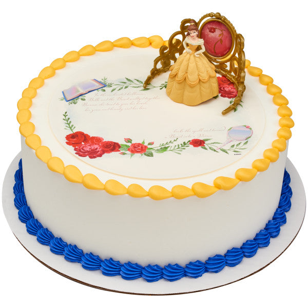 Round cake featuring the Belle cake topper set, golden icing trim, and an edible print design with floral details.