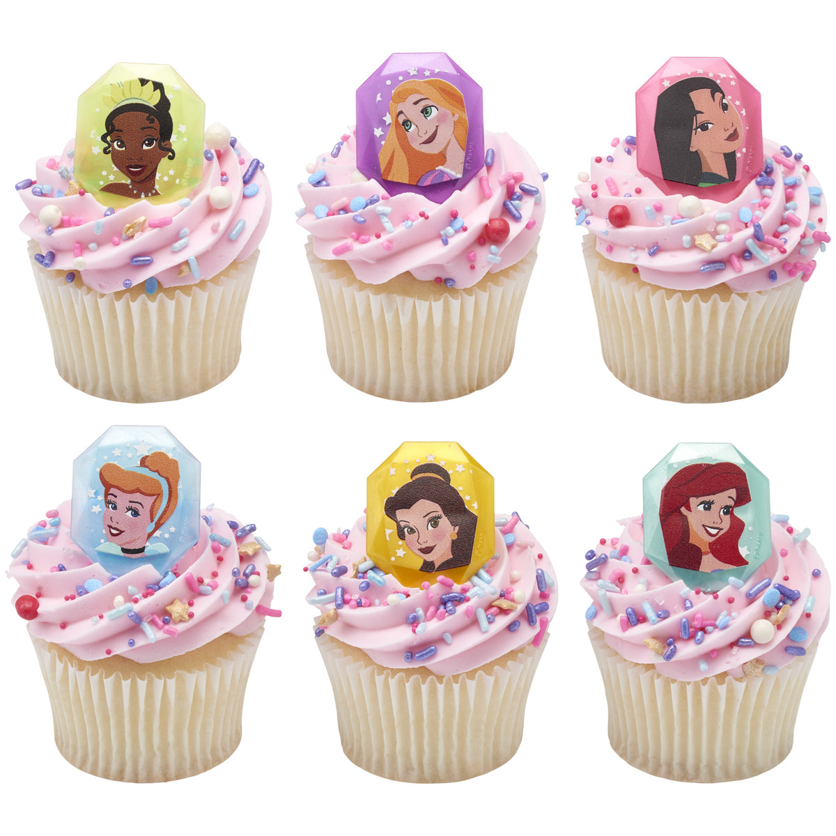 Six cupcakes with pink frosting and colorful sprinkles topped with Disney Princess rings featuring Tiana, Rapunzel, Mulan, Cinderella, Belle, and Ariel.