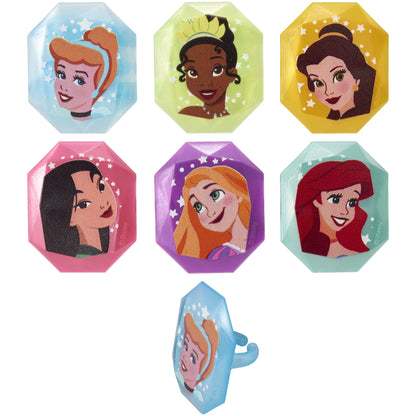 Assorted Disney Princess cupcake rings featuring Cinderella, Tiana, Belle, Mulan, Rapunzel, and Ariel in colorful blue, green, yellow, pink, purple, and aqua jewel-shaped frames.
