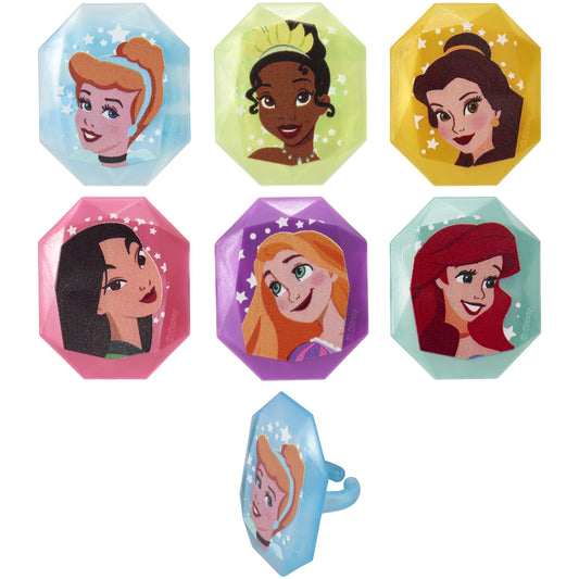 Assorted Disney Princess cupcake rings featuring Cinderella, Tiana, Belle, Mulan, Rapunzel, and Ariel in colorful blue, green, yellow, pink, purple, and aqua jewel-shaped frames.