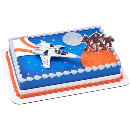 A rectangular cake decorated with a space theme, featuring the Lightyear jet and character pick.