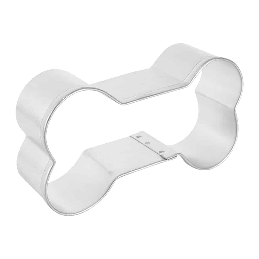 Side view of a dog bone cookie cutter, showing its sturdy depth and smooth design.