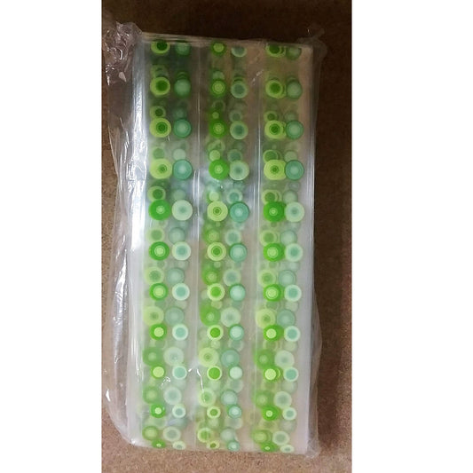 A package of clear poly treat bags with green dots printed in three vertical columns.