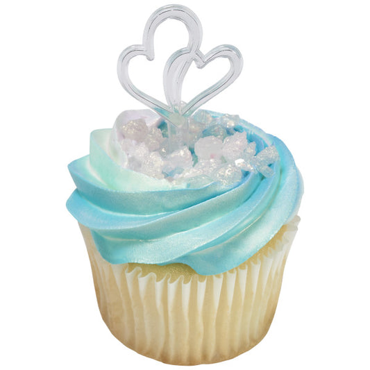 Light blue and white cupcake topped with rock candy and a silver double heart pick.