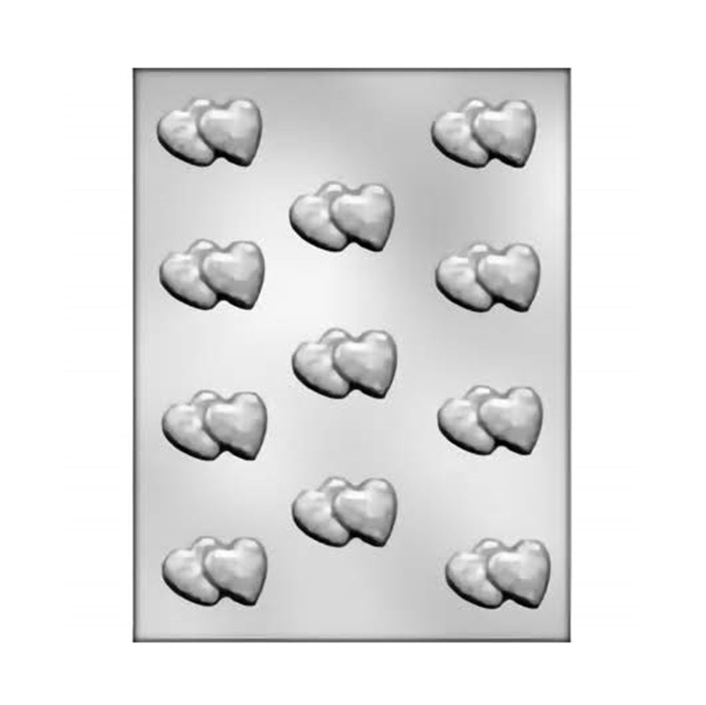 Chocolate mold with multiple cavities, each shaped as a pair of conjoined hearts, designed for creating double heart-shaped chocolates approximately one inch in size.