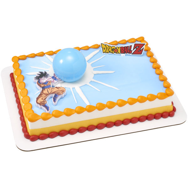 Rectangular sheet cake decorated with a blue burst design, Dragon Ball Z logo, and Goku topper with a raised blue Spirit Blast sphere, bordered with orange and red icing.