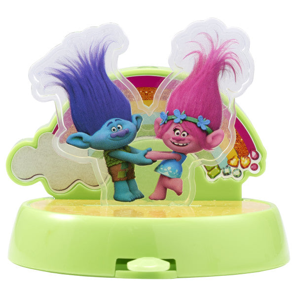 Trolls DecoSet® featuring favorite Trolls characters dancing in front of a rainbow on a bright green base.