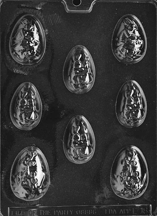 Chocolate mold of four large decorated eggs with floral and striped textures.