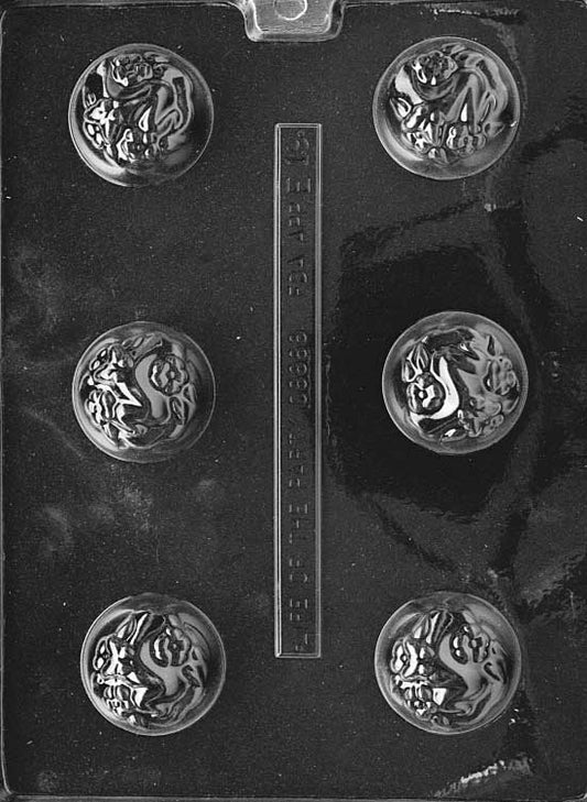 Round chocolate mold for filled puffs like marshmallow or nougat. Smooth domed shape.