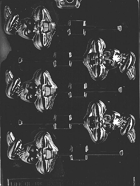 Chocolate mold of bunny with ears crossed over head and gentle smile.