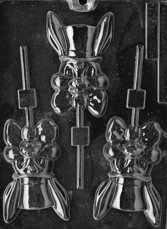 Chocolate mold of bunny in wide-brimmed hat with happy expression and stick channel.