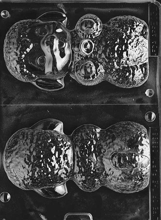 Chocolate mold of lamb with wooly texture and upright posture.