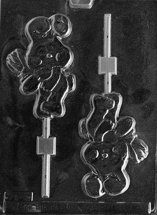 Chocolate mold of bunny standing and holding a flower.