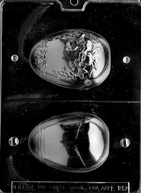 3D chocolate mold of medium egg with chick inside.