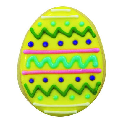 Easter egg-shaped cookie decorated with bright yellow icing, green and pink zigzags, and blue dots.