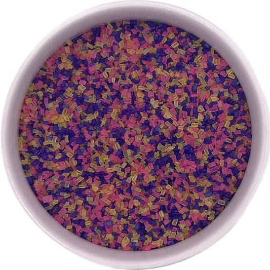 Easter coarse sugar in pink, yellow, and purple crystals in a white container for decorating cakes, cookies, and candies