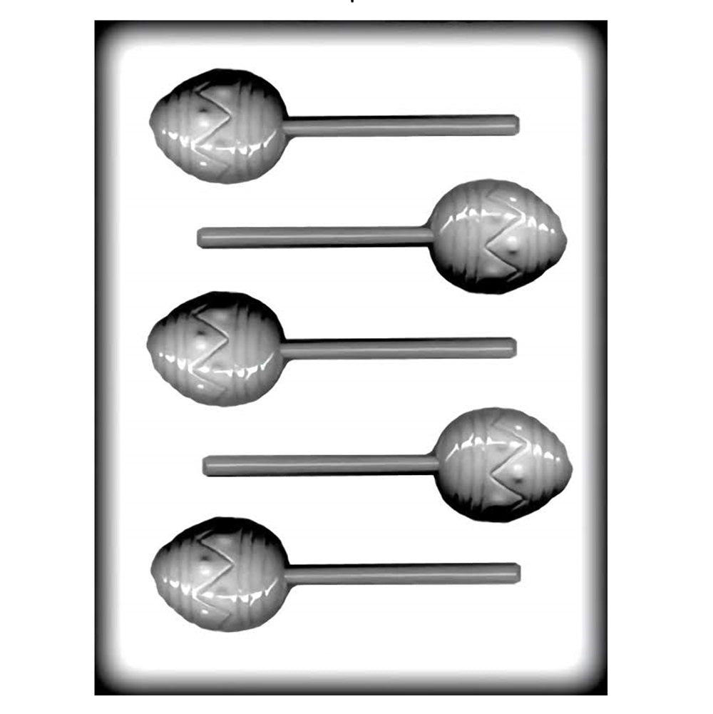 A white hard candy mold for making easter egg shaped hard candy suckers. Each mold has 5 egg shaped cavities with a slot in each egg for a sucker stick