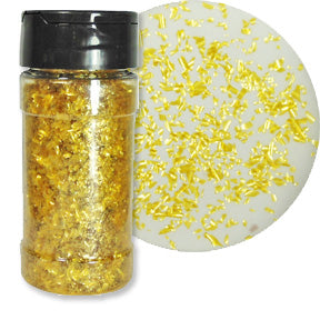 A bottle of gold edible glitter flakes with a close-up showing their shimmering texture.