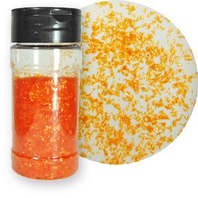 A bottle of orange edible glitter flakes with a close-up showing their shimmering texture.