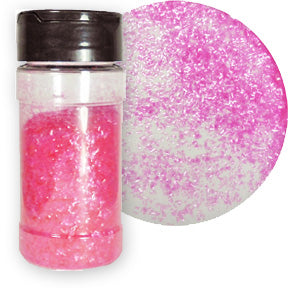 A bottle of pink edible glitter flakes with a close-up showing their shimmering texture.