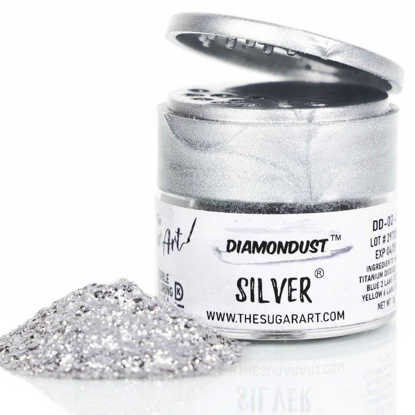Open jar of DiamondDust Silver edible glitter with a mound of fine silver sparkle in front; silver flip-top lid and product label reading “SILVER” visible. Keywords: silver edible glitter, DiamondDust, cake decorating, 4 grams.