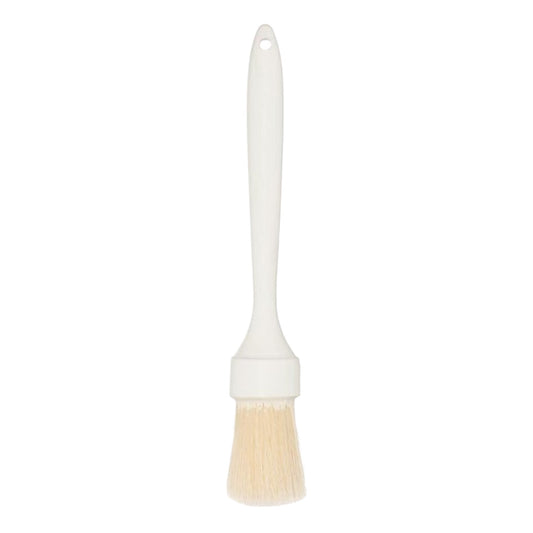 White pastry brush with cream bristles and a long plastic handle, isolated on a light background.
