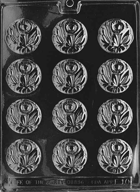FLOWER MINTS mold with round flower-shaped chocolate pieces.