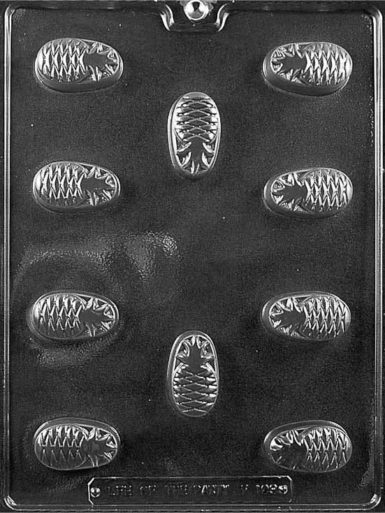 PINEAPPLE FOR FILLING mold featuring pineapple-shaped chocolate cavities.