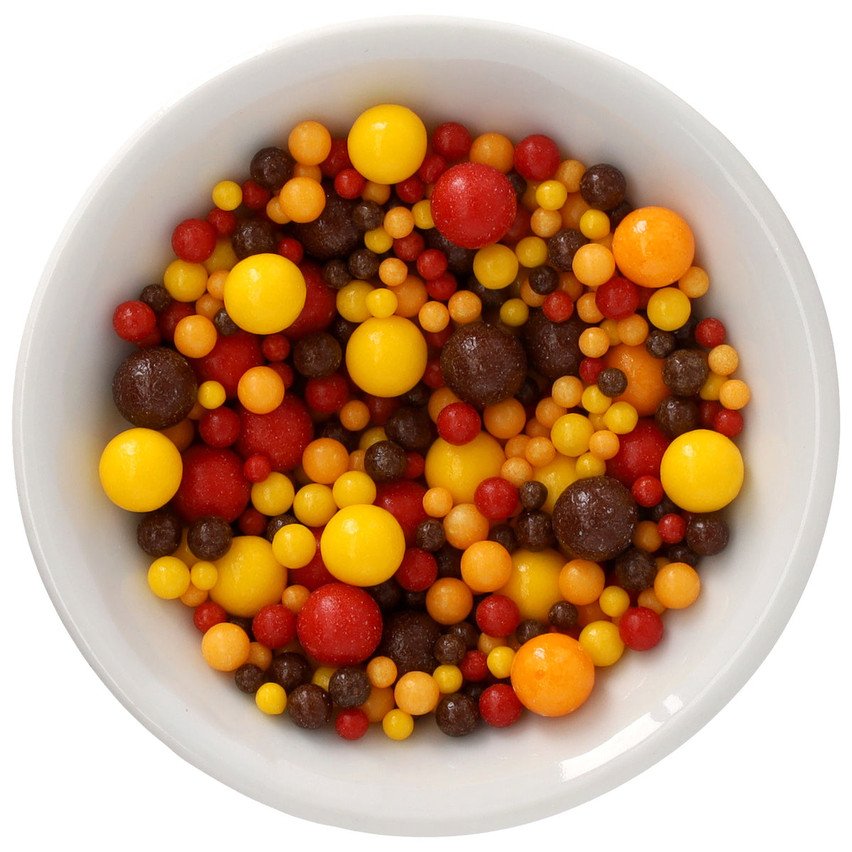 White bowl filled with Festive Fall Natural Dyed Made Simply™ sprinkles featuring assorted round pearls in yellow, orange, red, and deep brown in multiple sizes.