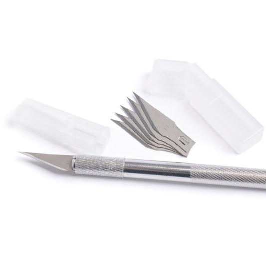 Fine detail craft knife with a textured metal handle and pointed blade, shown with five replacement blades and two clear plastic safety covers on a white background.