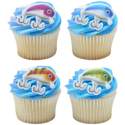Vanilla cupcakes with blue frosting topped with colorful fishing lure cupcake rings.