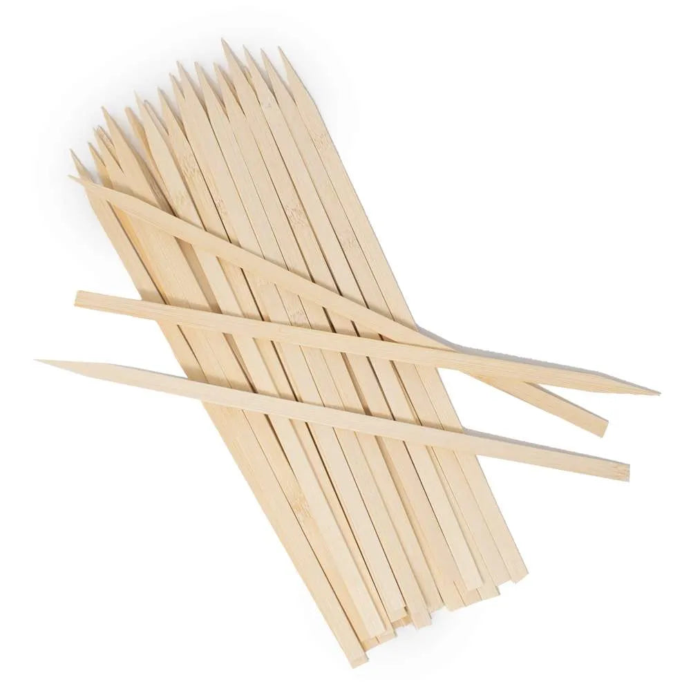 Close-up of bamboo skewers showcasing their flat shape and pointed ends for secure and easy skewering.