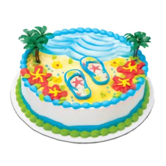 Flip flops cake topper set on a beach-themed round cake with blue water icing and colorful accents, perfect for summer celebrations or beach party cakes.