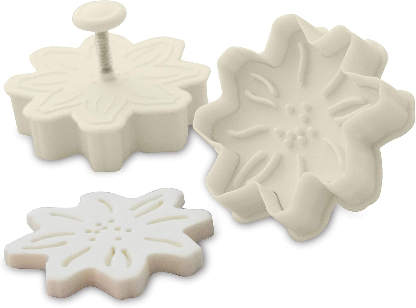 Close-up of a flower plunger cutter with an imprinted fondant flower design.