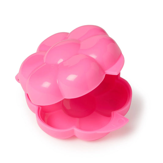 Bright pink two-piece flower cake pop mold shown partially open, revealing the smooth rounded interior cavities and hinged petal-shaped design.