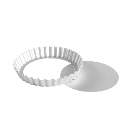 6 1/2 inch round fluted tart pan with 1-inch depth, shown with its removable bottom separated for easy release.