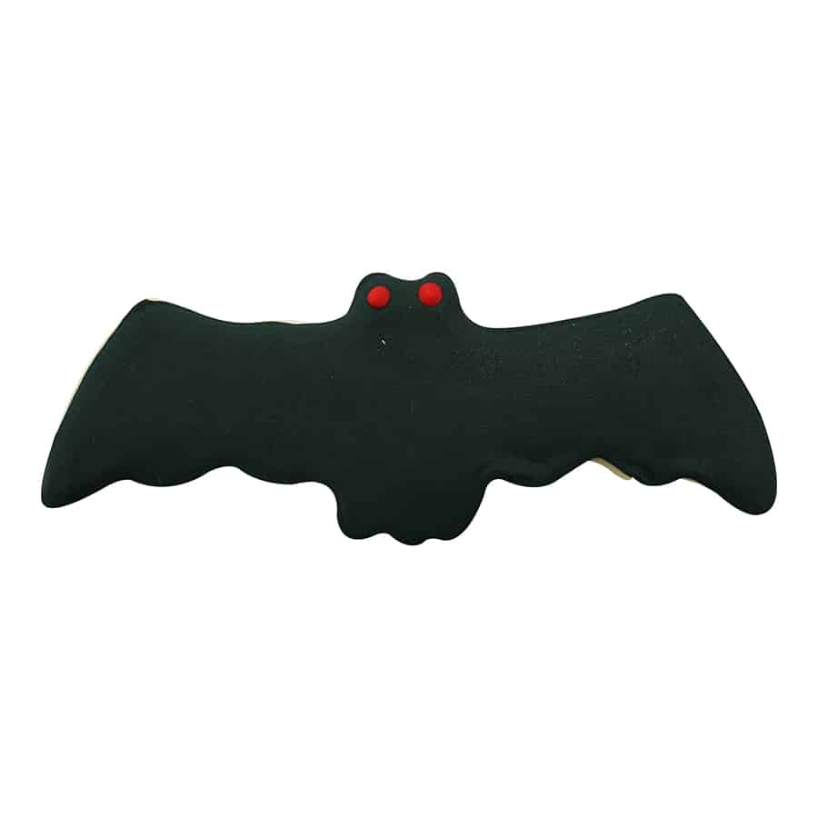 Black bat-shaped cookie with red eyes, showcasing a decorated treat made using the cutter.