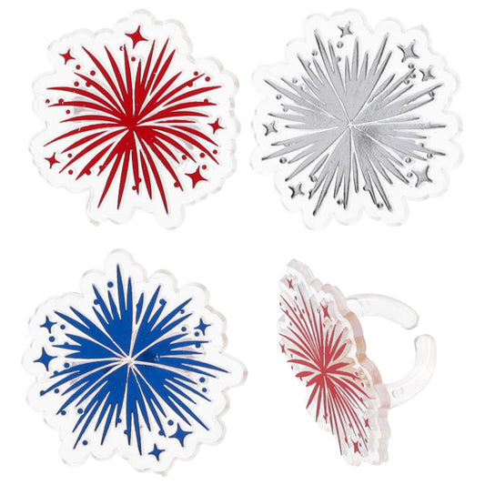 Foil fireworks cupcake rings with metallic red, silver, and blue burst designs on clear ring bands, shown on a white background with one ring displayed from the side.