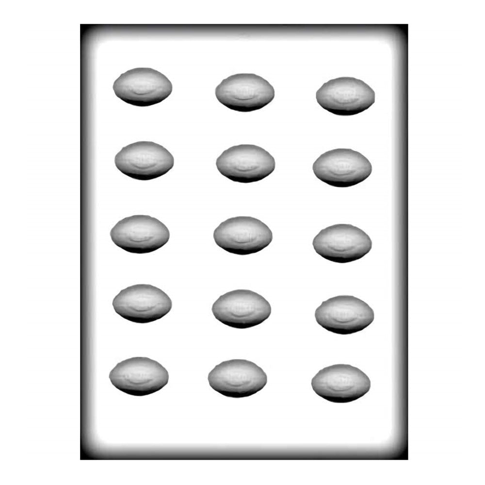 Alt text: "This image displays a white plastic hard candy mold with multiple cavities shaped like miniature footballs. There are four rows and four columns, making a total of 16 cavities. Each cavity is designed to resemble a classic American football with stitched details, and they are approximately 1 1/2 inches in size. The mold is depicted from a top-down view, showing the three-dimensional contours of each football cavity."