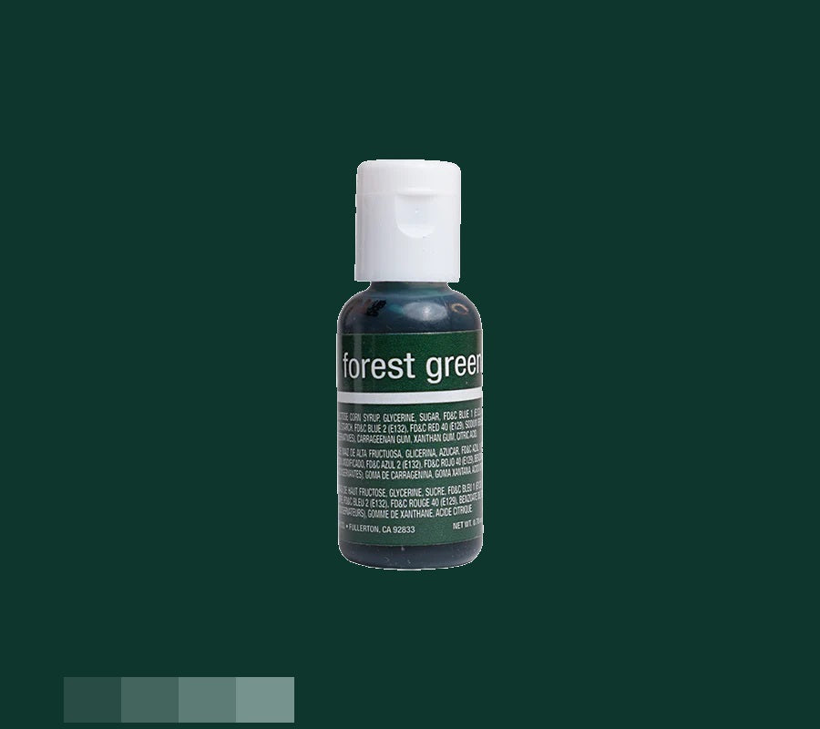The image captures a bottle of chefmaster food coloring with a dark green gel, labeled "forest green". The white cap sits on top of the bottle, whose label bears white text with product information against a background that reflects the rich, deep green shade of the gel.