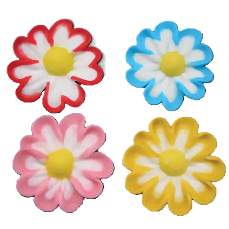 A set of four royal icing flowers in striking colors with white and red petals, blue and white petals, pink and white petals, and yellow and white petals, each with a sunny yellow center. Their bold outlines and contrasting centers make them stand out as decorative elements on any sweet creation.