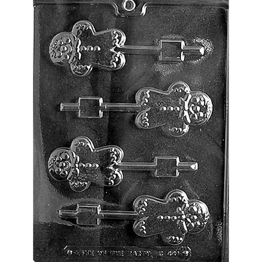 Clear plastic chocolate lollipop mold with four small gingerbread man cavities featuring a smiling face, bow tie, button details, and stick channels, shown on a dark background.