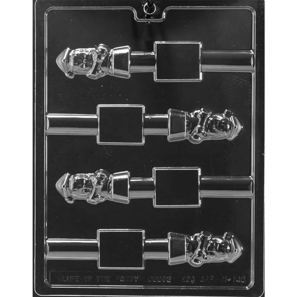 Clear plastic chocolate mold with four pretzel-topper cavities showing a small girl graduate figure beside a rectangular base area, arranged in rows on a dark background.