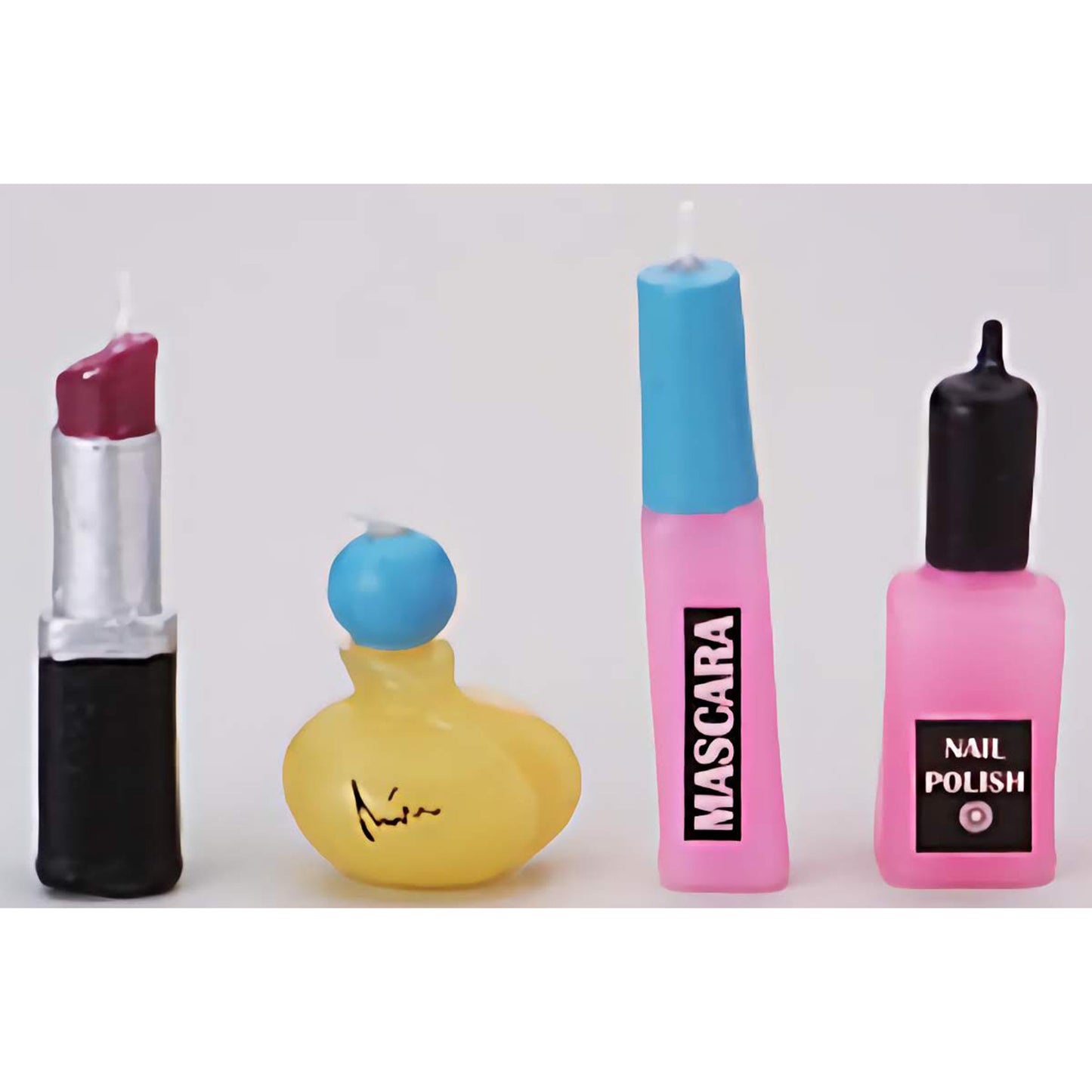 Girls Make Up Novelty Candle Set featuring candles shaped like lipstick, perfume, mascara, and nail polish, perfect for adding a stylish touch to girlie-themed celebrations.