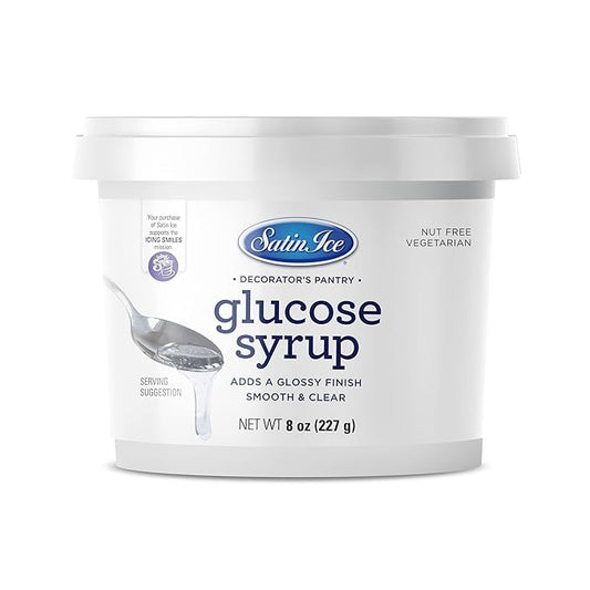 8 oz tub of Satin Ice Glucose Syrup with a spoonful of smooth, clear syrup, used in fondant, candy, and sweet decorating applications.